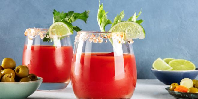 two glasses of non-alcholic bloody mary with garnish